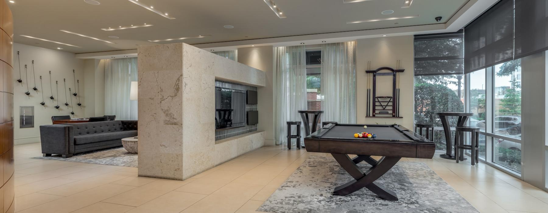 billiards table and large screen tv in clubhouse