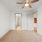 carpeted bedroom with private bathroom