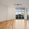 spacious living area with track lighting