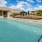 lounge deck with umbrellas near pool